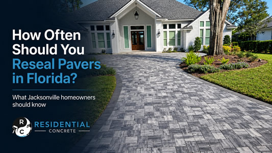Freshly resealed gray paver driveway leading to a jacksonville florida home