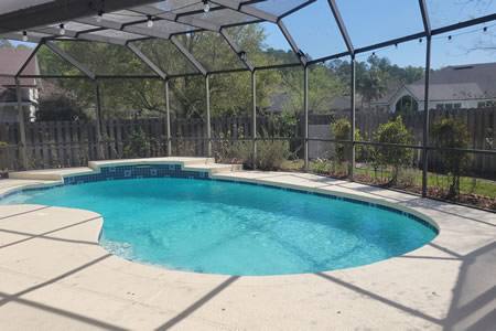 Professional pool deck cleaning on a jacksonville florida home - algae removal and surface wash