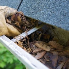 Gutter Cleaning in Humid Climates: How Clogged Downspouts Damage Concrete Thumbnail
